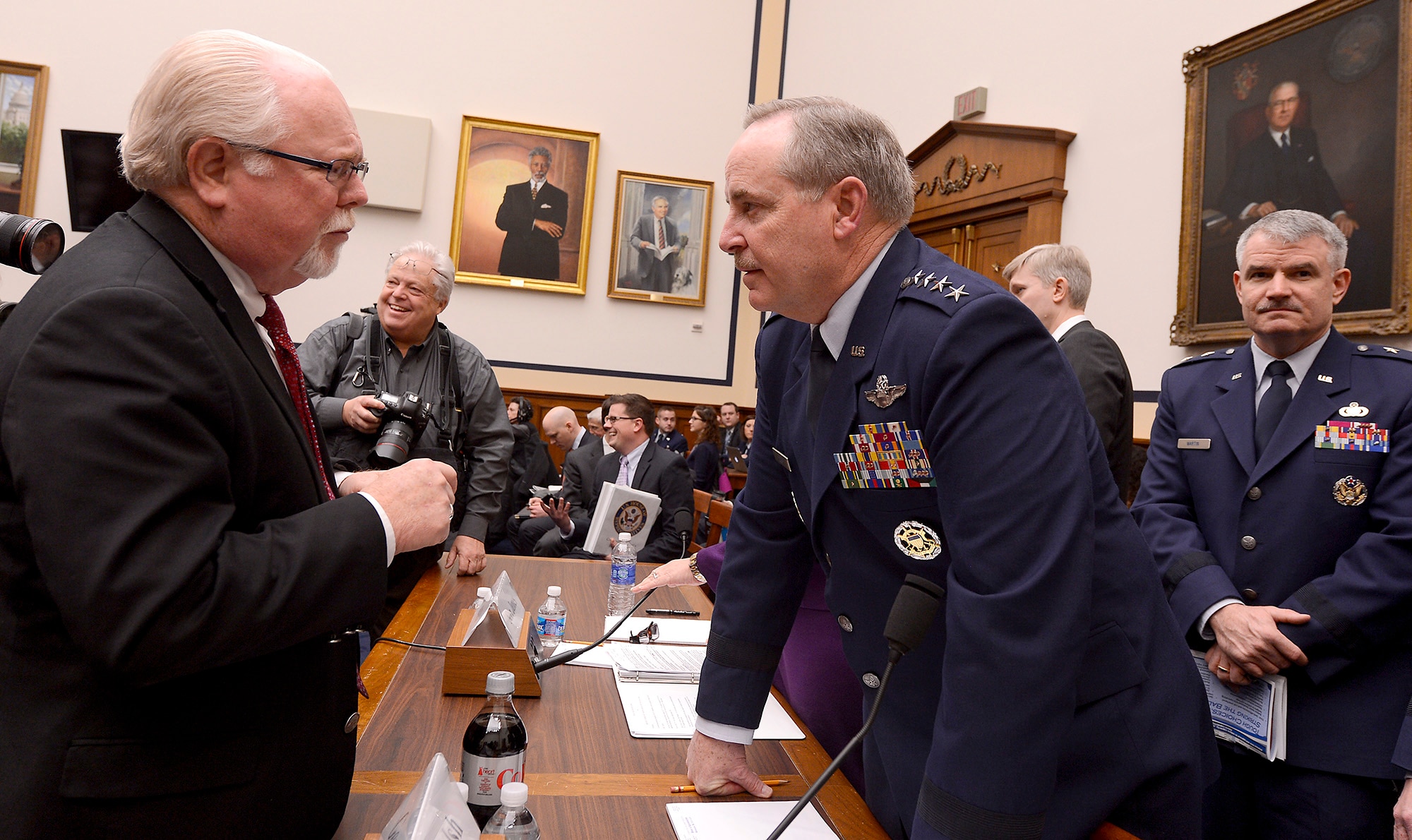 Air Force Chief of Staff Gen. Mark A. Welsh III speaks with Rep. Ron Barber, R-Ariz., before Welsh and Secretary of the Air Force Deborah Lee James testified on the Air Force's fiscal year 2015 budget request in front of the House Armed Services Committee in Washington, D.C., March 14, 2014.  (U.S. Air Force photo/Scott M. Ash)