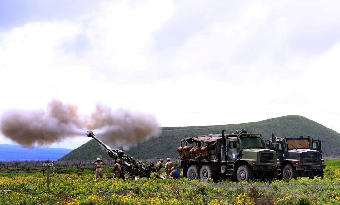 Field artillerymen with Bravo Battery, 1st Battalion, 12th Marine Regiment, fire the M777 155 mm Howitzer system during Operation Spartan Fury 14.2 at Pohakuloa Training Area, Hawaii, March 7, 2014. (U.S. Marine Corps photo by Cpl. Nathan Knapke)