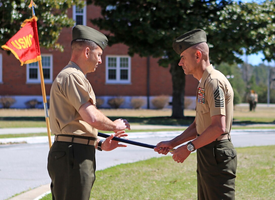 Sgt. Maj. Octaviano Gallegos Jr., right, the outgoing 24th Marine Expeditionary Unit sergeant major, passes a non-commissioned officer's sword to Col. Scott F. Benedict, the commanding officer of the 24th MEU during Gallegos' relief and appointment ceremony March 14, 2014, at Camp Lejeune, N.C. Gallegos' next assignment is sergeant major of II Marine Expeditionary Brigade. He was relieved by Sgt. Maj. Lanette N. Wright, who will be the first female MEU sergeant major.