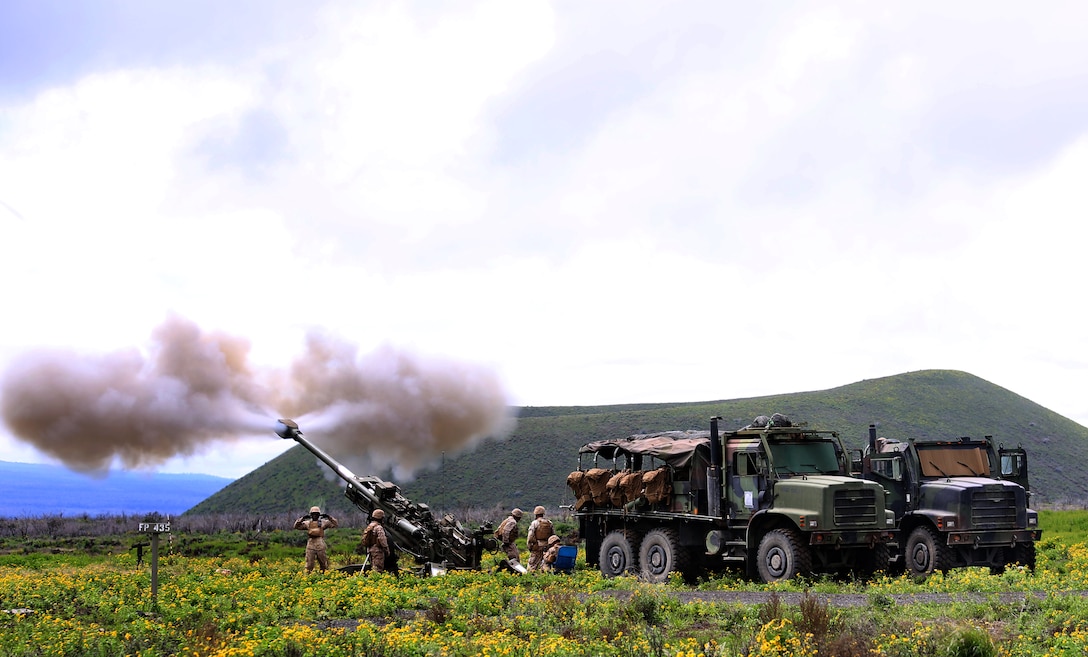 Field artillerymen with Bravo Battery, 1st Battalion, 12th Marine Regiment, fire the M777 155 mm Howitzer system during Operation Spartan Fury 14.2 at Pohakuloa Training Area, Hawaii, March 7, 2014. (U.S. Marine Corps photo by Cpl. Nathan Knapke)