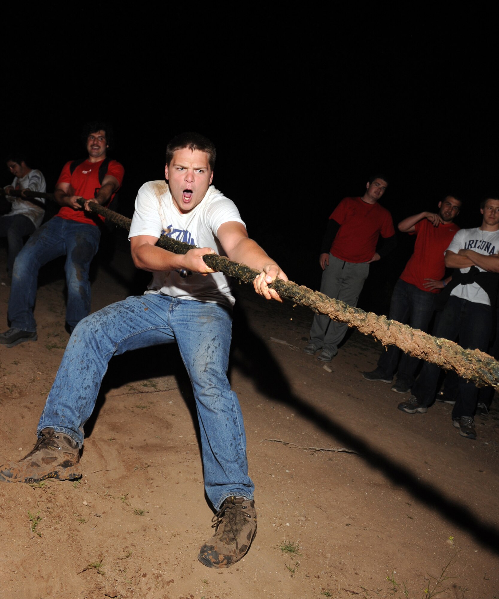 University of Arizona Rugby team players compete in a tug-of-war tournament at Davis-Monthan Air Force Base, Ariz., March 8, 2014. The goal of the tug-of-war tournament was to increase efficiency among the players by creating a stronger bond through teamwork. (U.S. Air Force photo by Airman 1st Class Chris Drzazgowski/Released)   