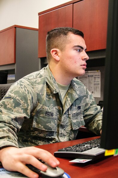 Airman Patrick Brand, 446th Aircraft Maintenance Squadron crew chief, Joint Base Lewis-McChord, Wash. fills out the recently-upgraded DD Form 2266, Hometown News Release, March 5. The biggest advantage of the new system is the ability for service members and civilians alike to submit a Hometown News Release from any computer anywhere. Brand said he finished submitting his release in no time. (U.S. Air Force Reserve photo/Jake Chappelle)