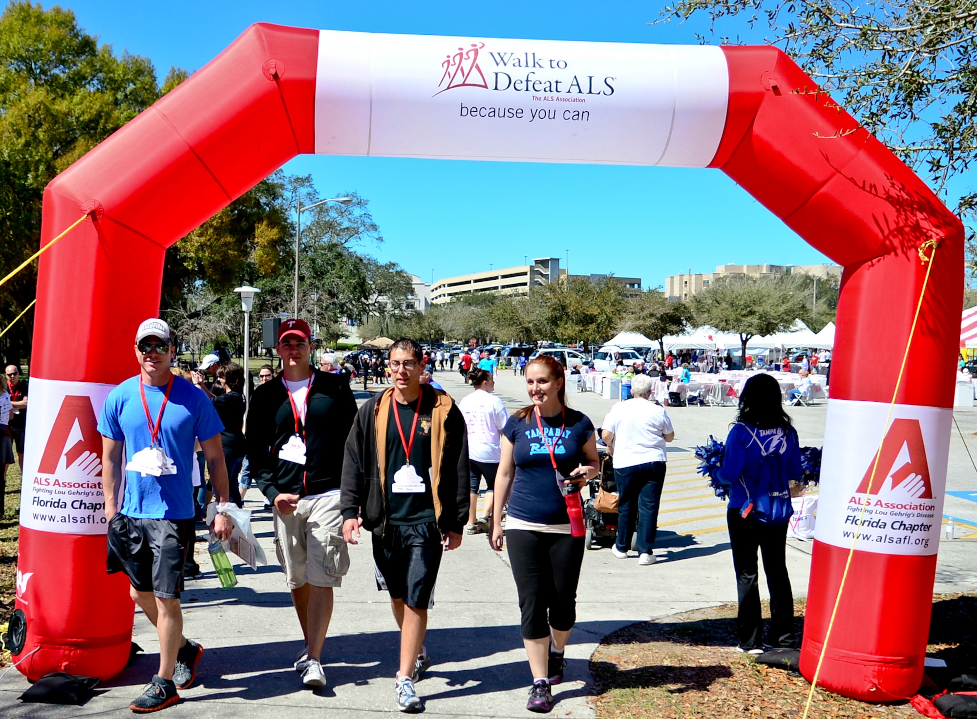 Members from Team MacDill cross the finish line after a 2K walk at the University of South Florida in support of the Walk to Defeat Amyotrophic Lateral Sclerosis event, March 8, 2014. ALS, often referred to as "Lou Gehrig's Disease," is a fatal progressive neurodegenerative disease that affects nerve cells in the brain and the spinal cord. (U.S. Air Force photo by Senior Airman Melanie Bulow-Gonterman/Released)   