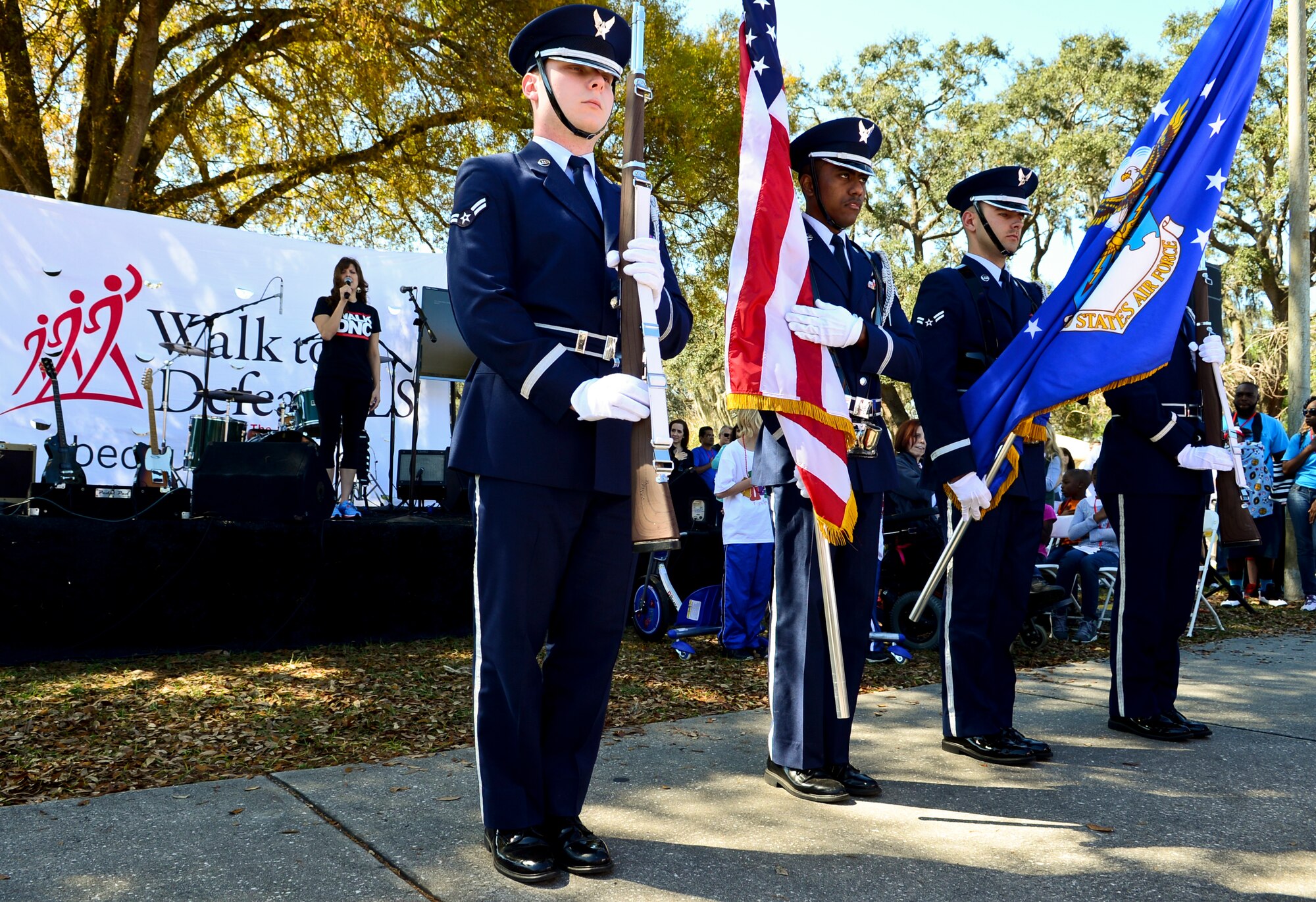 Honor guardsmen from MacDill Air Force Base, Fla., present the colors while the National Anthem is sung before the Walk to Defeat Amyotrophic Lateral Sclerosis event at the University of South Florida, March 8, 2014. Team Tampa Bay Military raised more than 300 dollars contributing to finding the cause and cure to ALS. (U.S. Air Force photo by Senior Airman Melanie Bulow-Gonterman/Released) 