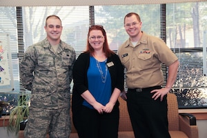 Teresa Osorio, Heritage Trust Federal Credit Union Branch Manager and Military Saves Pledge Drive representative, stands  with Military Saves Week Winners:  1st Place, Airman 1st Class Vincent Brock, 628th Logistics Readiness Squadron, and 3rd Place winner, Petty Officer 1st Class Christopher Fendley, Naval Nuclear Power Training Command, at the Airman and Family Readiness Center on Joint Base Charleston – Air Base Charleston, S.C.  The winners received $50 gift cards from Navy Federal Credit Union and Heritage Trust Federal Credit Union for their participation in the Military Saves Pledge Drive. Second place winner, Airman 1st Class Zach Woodard, 628th Comptroller Squadron is not pictured. 