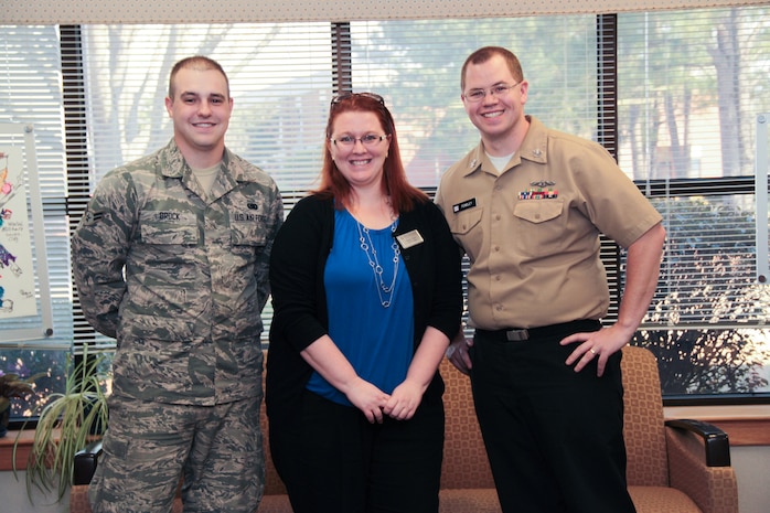 Teresa Osorio, Heritage Trust Federal Credit Union Branch Manager and Military Saves Pledge Drive representative, stands  with Military Saves Week Winners:  1st Place, Airman 1st Class Vincent Brock, 628th Logistics Readiness Squadron, and 3rd Place winner, Petty Officer 1st Class Christopher Fendley, Naval Nuclear Power Training Command, at the Airman and Family Readiness Center on Joint Base Charleston – Air Base Charleston, S.C.  The winners received $50 gift cards from Navy Federal Credit Union and Heritage Trust Federal Credit Union for their participation in the Military Saves Pledge Drive. Second place winner, Airman 1st Class Zach Woodard, 628th Comptroller Squadron is not pictured. 