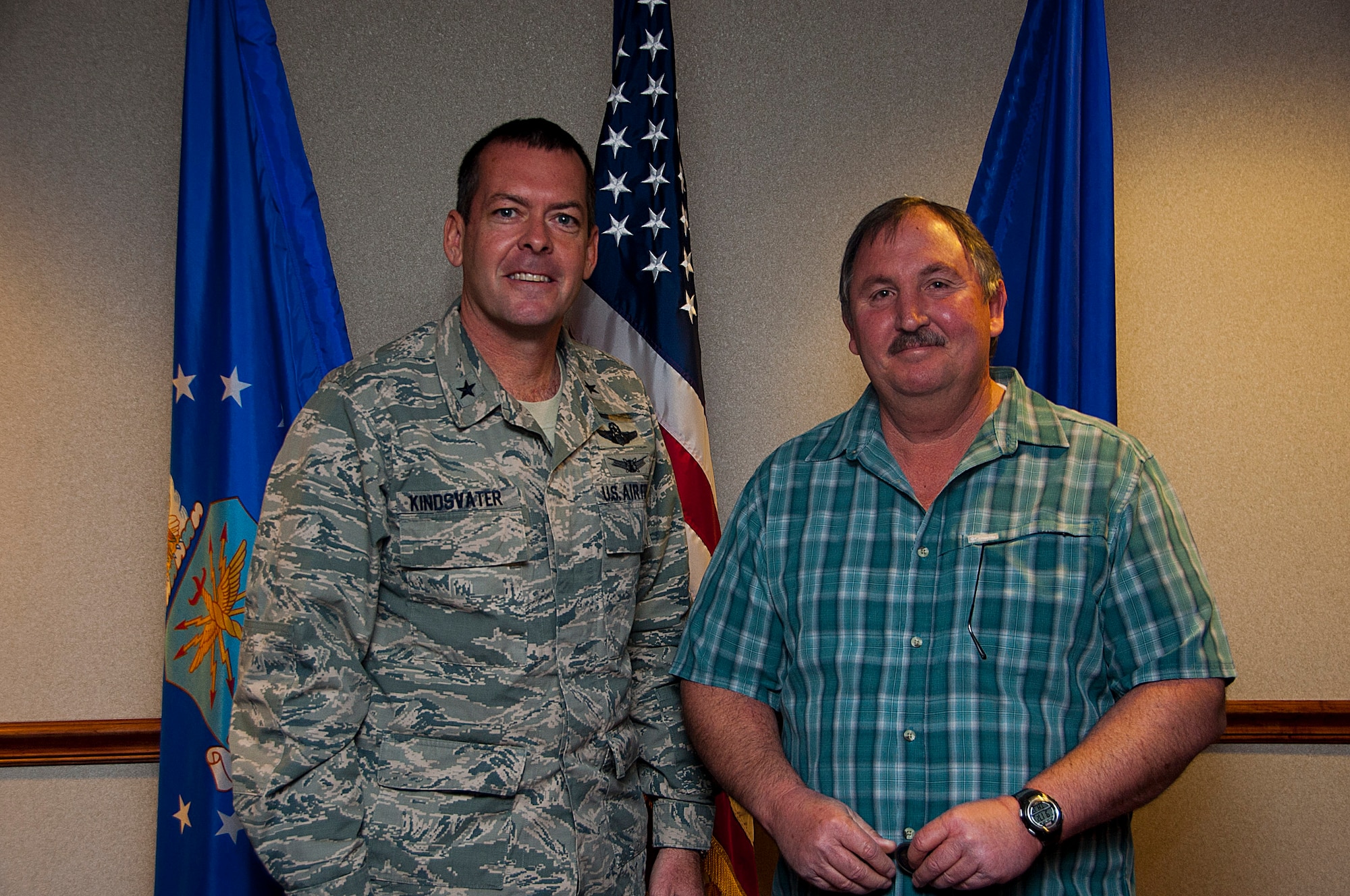Frank Carter, 82nd Training Wing Public Affairs photographer, earned the Civilian Photographer of the Year award at the Air Force level. He was congratulated March 13 by Brig. Gen. Scott Kindsvater, 82nd Training Wing commander. (U.S. Air Force photo by Robert Mcilrath)