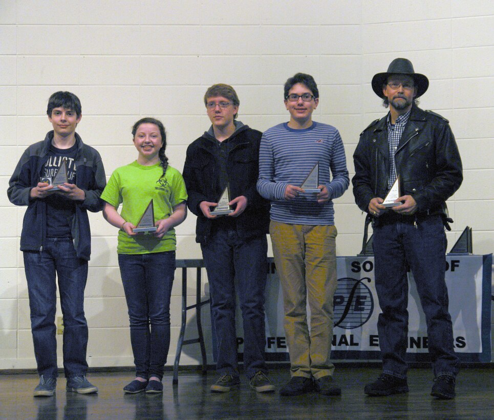 East Middle School team students (l-r) Zane Sharp, Abbie Daniel, Bradley Holmes and Cooper Yoder from Tullahoma won second place at the Engineers Week MathCounts competition Feb. 15. Their coach is Trent Stout (far right.) (Photo provided)