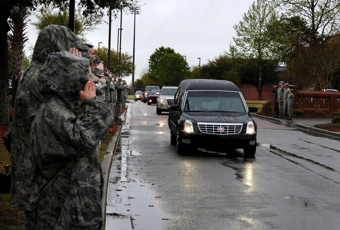 U.S. Air Force Airmen from Joint Base Charleston pay their final respects to U.S. Army Chief Warrant Officer 5th Class Curtis Reagan as his family and funeral procession leave Joint Base Charleston - Air Base, April 4, 2013. (U.S. Air Force photo/Senior Airman Logan Brandt)