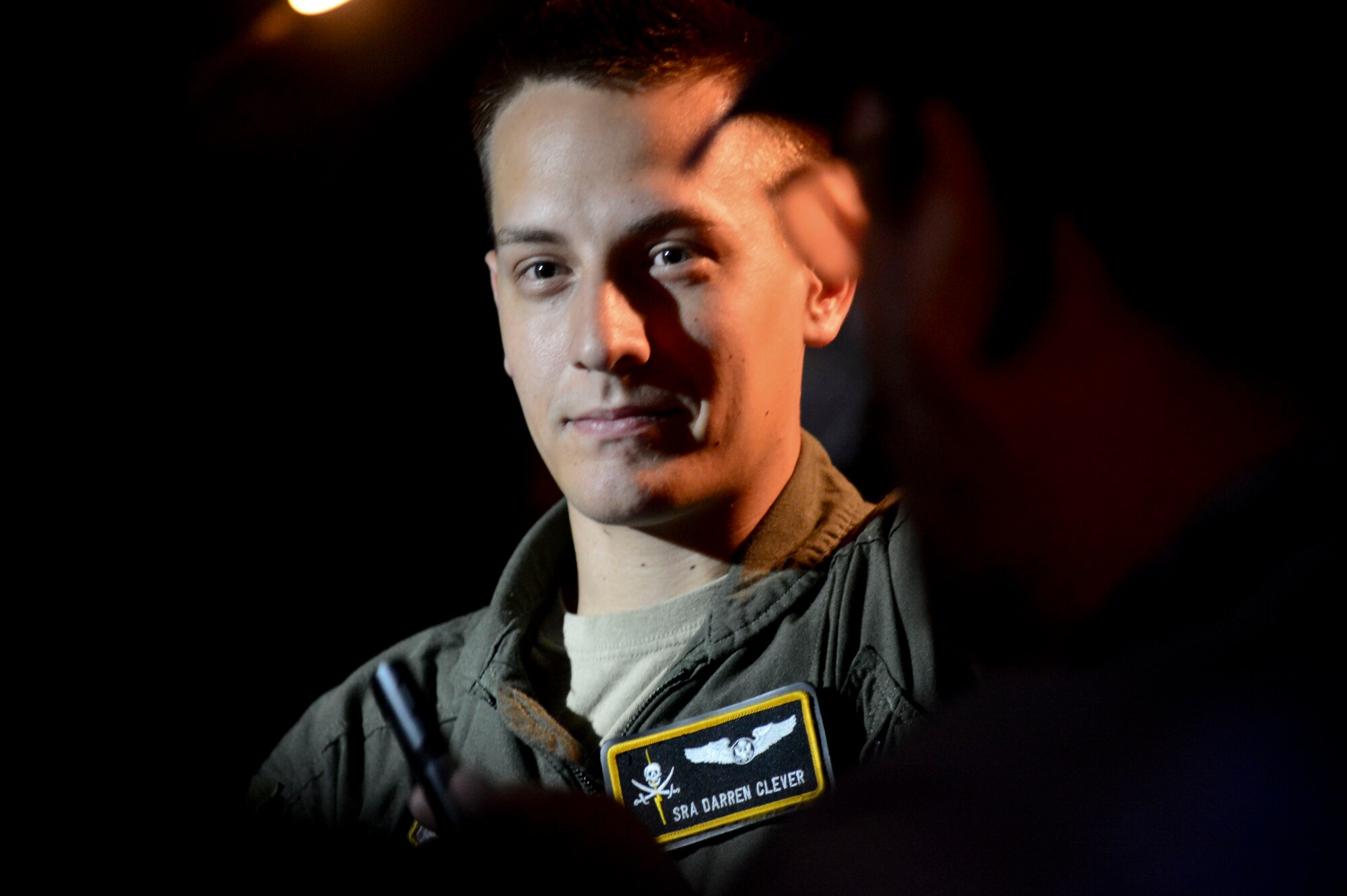 Senior Airman Darren Clever, 91st Air Refueling Squadron boom operator, is interviewed by media March 12, 2014 at MacDill Air Force Base, Fla. Roughly 15 media personnel captured and documented the mission through photographs, video and interviews. (U.S. Air Force photo by Senior Airman Jenay Randolph/Released)