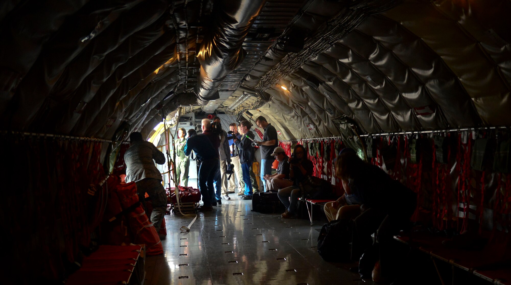 Media from the city of Tampa, Fla. documents footage in the grounded KC-135 Stratotanker before a media operations flight March 12, 2014 at MacDill Air Force Base, Fla. Roughly 15 media personnel captured and documented the mission through photographs, video and interviews. (U.S. Air Force photo by Senior Airman Jenay Randolph/Released)