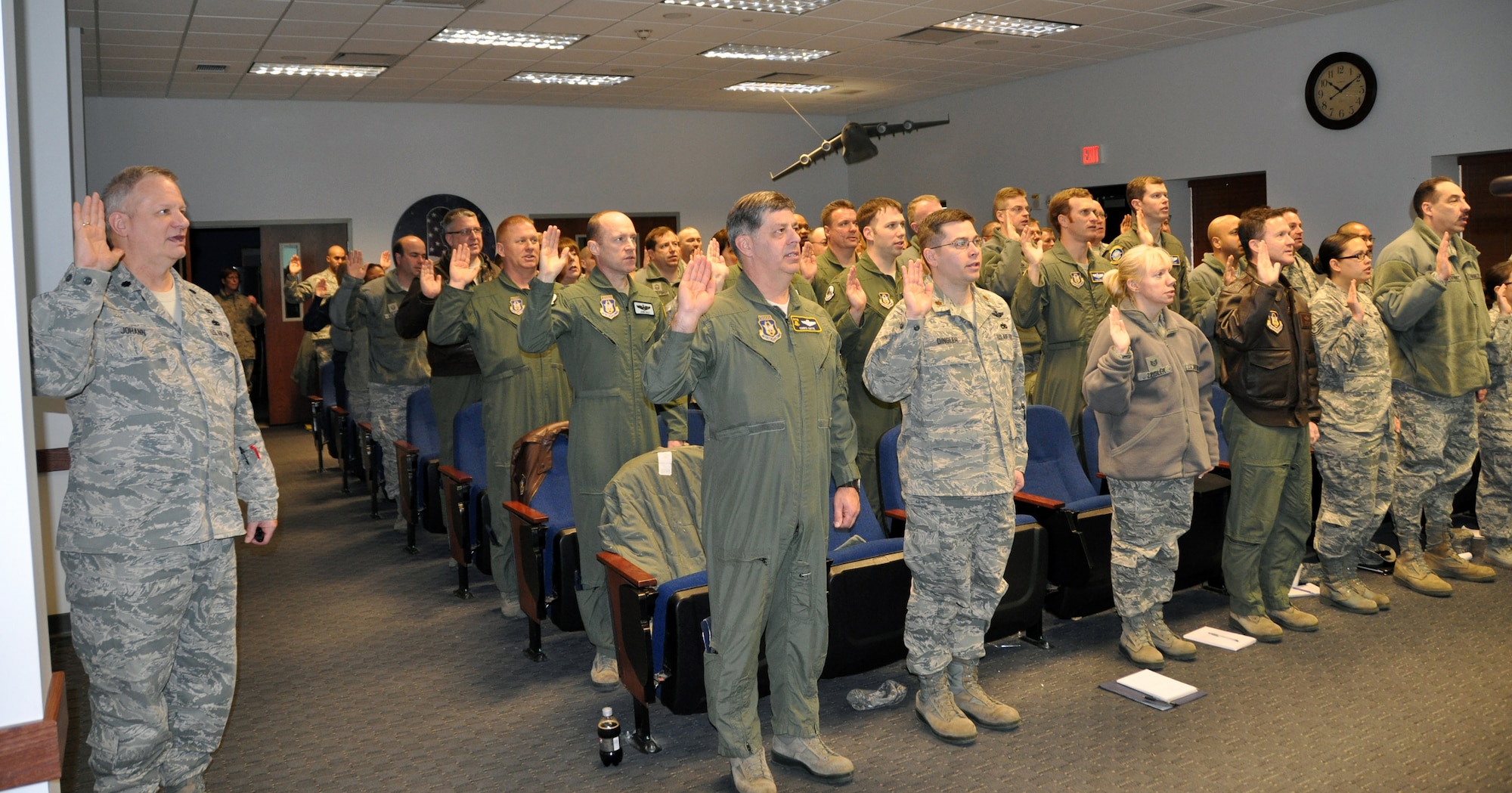 The 512th Airlift Wing's Wing Inspection Team takes an oath to perform their jobs honestly and with integrity Feb. 8, 2014 at Dover Air Force Base, Del. The WIT is an integral part of the wing commander’s inspection program. (U.S. Air Force photo/Senior Airman Joe Yanik)