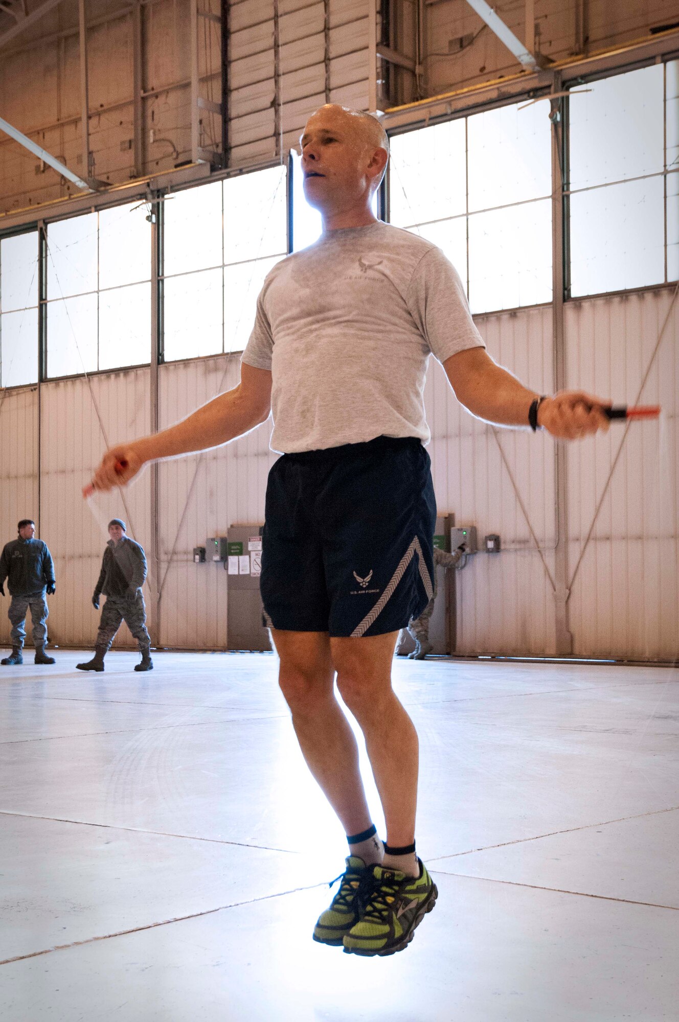 Airmen from the 133rd Airlift Wing’s Communication Flight, Maintenance Group and Public Affairs Office came together for some additional camaraderie and physical training during their busy drill weekend, here in the north hangar, Feb. 23, 2014. (U.S. Air National Guard photo by Staff Sgt. Austen Adriaens/Released)