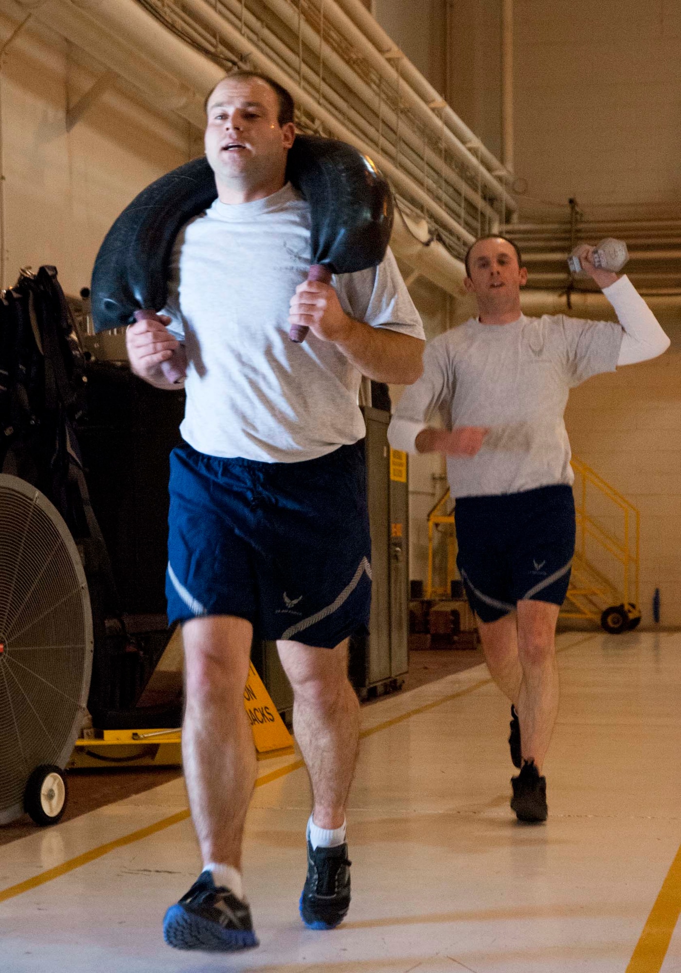 Airmen from the 133rd Airlift Wing’s Communication Flight, Maintenance Group and Public Affairs Office came together for some additional camaraderie and physical training during their busy drill weekend, here in the north hangar, Feb. 23, 2014. (U.S. Air National Guard photo by Staff Sgt. Austen Adriaens/Released)