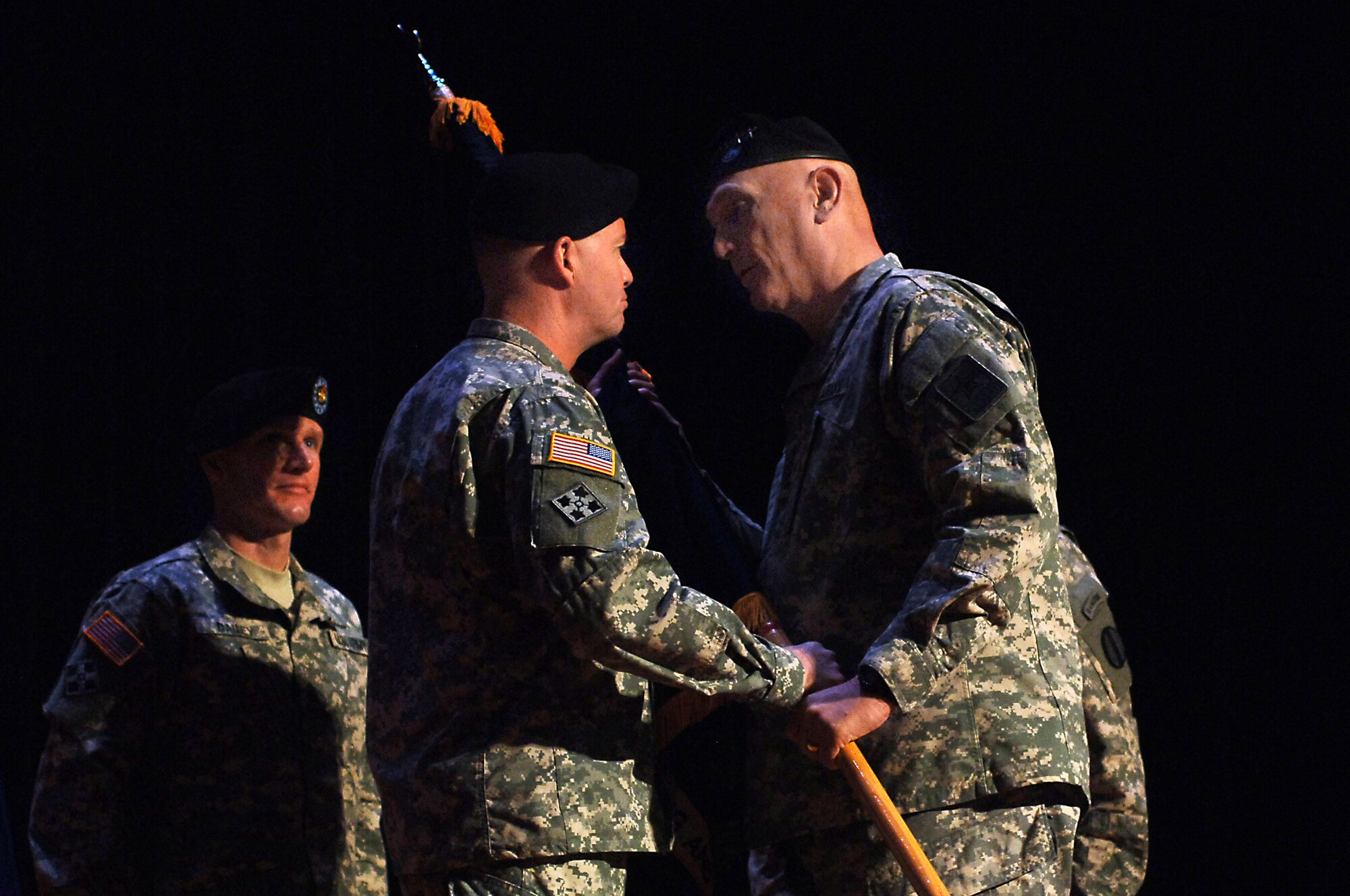U.S. Army Gen. David Perkins, left, U.S. Army Training and Doctrine Command incoming commander, accepts the unit colors from Gen. Raymond Odierno, right, U.S. Army chief of staff, during a change of command ceremony at Fort Eustis, Va., March 14, 2014. Perkins assumed command of TRADOC from Gen. Robert Cone. Perkins hails from N.H., and Odierno is a native of Rockaway, N.J. (U.S. Air Force photo by Senior Airman Teresa J.C. Aber/Released)