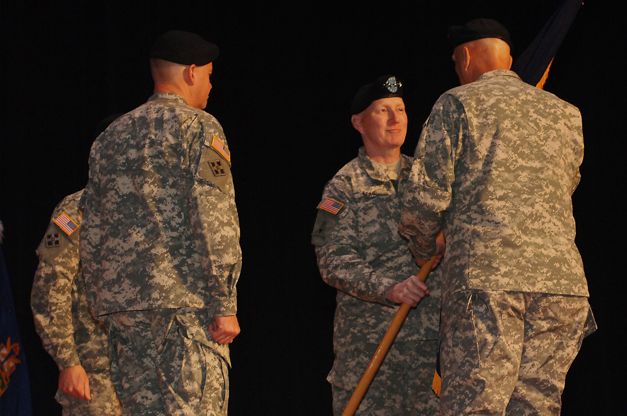 U.S. Army Gen. Robert Cone, outgoing U.S. Army Training and Doctrine Command commander, passes the unit colors to Gen. Raymond Odierno, U.S. Army chief of staff, during a change of command ceremony at Fort Eustis, Va., March 14, 2014. This ceremony represented Cone’s final duty assignment before his retirement. (U.S. Air Force photo by Senior Airman Teresa J.C. Aber/Released)