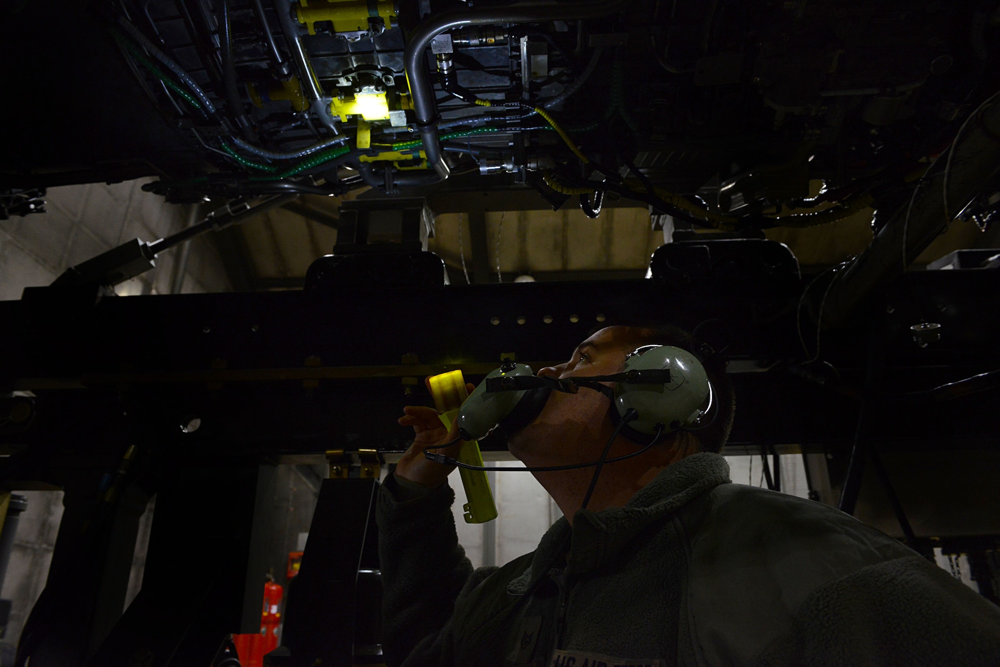 U.S. Air Force Staff Sgt. Daniel Gallentine, 20th Component Maintenance Squadron jet engine craftsman, inspects a jet engine at the engine test facility, Shaw Air Force Base, S.C., March 13, 2014. Gallentine checked for oil and air leaks as well as any vibrating parts while jet fuel was ignited in the engine to ensure all components were working properly. (U.S. Air Force photo by Airman 1st Class Jensen Stidham/Released)