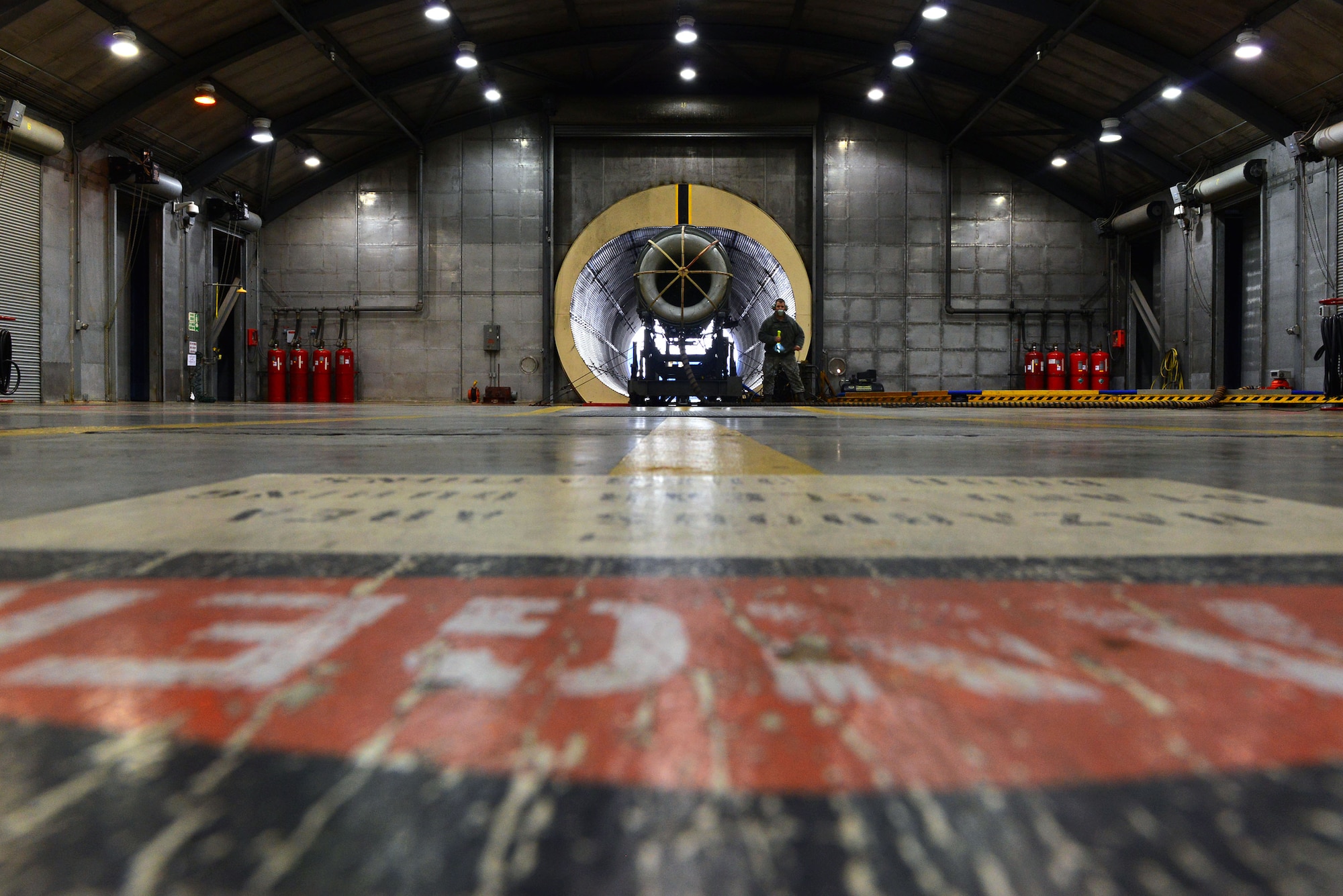U.S. Air Force Staff Sgt. Daniel Gallentine, 20th Component Maintenance Squadron jet engine craftsman, prepares to inspect a jet engine at the engine test facility, Shaw Air Force Base, S.C., March 13, 2014. Approximately 70 F110-General Electric-129 jet engines are tested every year in the hush room which is made up of hundreds of soundproof and vibration proof panels. (U.S. Air Force photo by Airman 1st Class Jensen Stidham/Released)
