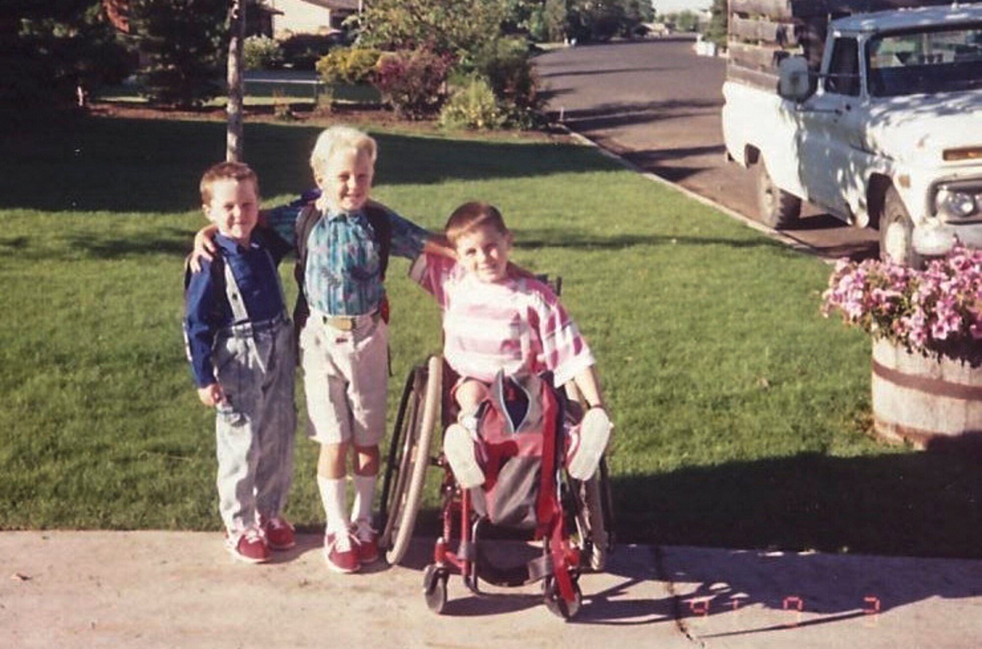 Tyler Byers, Team Buckley civilian Airman and two-time Paralympic Games competitor, poses with his brothers in a photo from his childhood. Byers competed in the 2004 Paralympic Games in Athens and the 2008 Paralympic Games in Beijing. (U.S. Air Force photo by Staff Sgt. Nicholas Rau/Released)