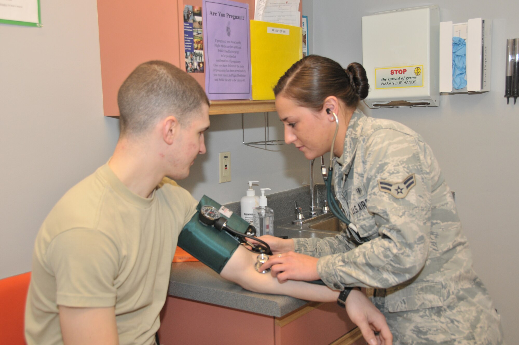 STRATTON AIR NATIONAL GUARD BASE, N.Y. -- Airman 1st Class Xenia Wieland takes a patient's blood pressure at the clinic here on March 10, 2014. Weiland is a XXX with the 109th Medical Group. (Air National Guard photo by Tech. Sgt. Catharine Schmidt/Released)
