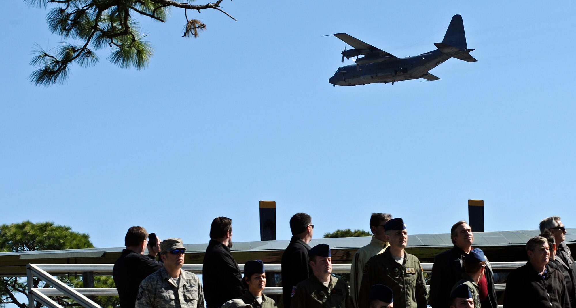 An AC-130H Spectre gunship flys over the Jockey-14 memorial ceremony at the air park on Hurlburt Field, Fla., March 14, 2014. Today marked the 20th anniversary of when the aircraft experienced an in-flight explosion, which killed eight of the 14 aircrew members who were supporting Operation Continue Hope II in Somalia. (U.S. Air Force photo/Senior Airman Michelle Patten)

