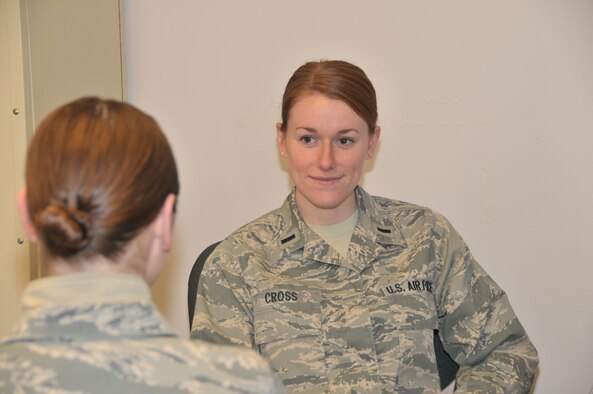 STRATTON AIR NATIONAL GUARD BASE, N.Y. -- First Lt. Lynsey Cross, 109th Medical Group, talks to an Airman on March 10, 2014 about suicide prevention. She is a health services adminstrator and suicide prevention program manager for the 109th Airlift Wing. (Air National Guard photo by Tech. Sgt. Catharine Schmidt/Released)