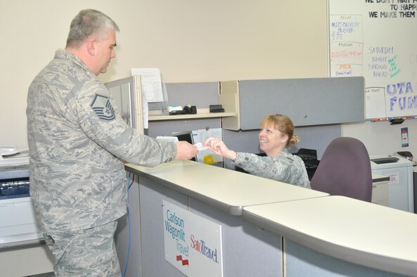 STRATTON AIR NATIONAL GUARD BASE, N.Y. -- Senior Master Sgt. Deborah Gardner gives out information to a Transportation Management Office customer March 9, 2014. Gardner has been filling the additional duty of ticketing for 109th Airlift Wing travelers. Her primary position is with vehicle management and analysis with the 109th Logistics Readiness Squadron's Vehicle Maitenance Flight. (Air National Guard photo by Tech. Sgt. Catharine Schmidt/Released)