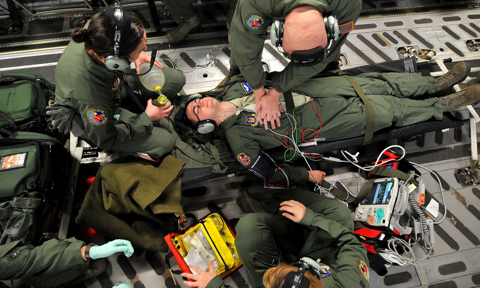 WRIGHT-PATTERSON AIR FORCE BASE, Ohio – 445th Aeromedical Evacuation Squadron Airmen train on board a 445th Airlift Wing C-17 Globemaster III Feb. 22 in preparation for real life emergencies. Members of the 445th AES are ready to fill the need when events like natural disasters, war or routine medical transportation by air is required. (U.S. Air Force photo/Tech. Sgt. Frank Oliver)