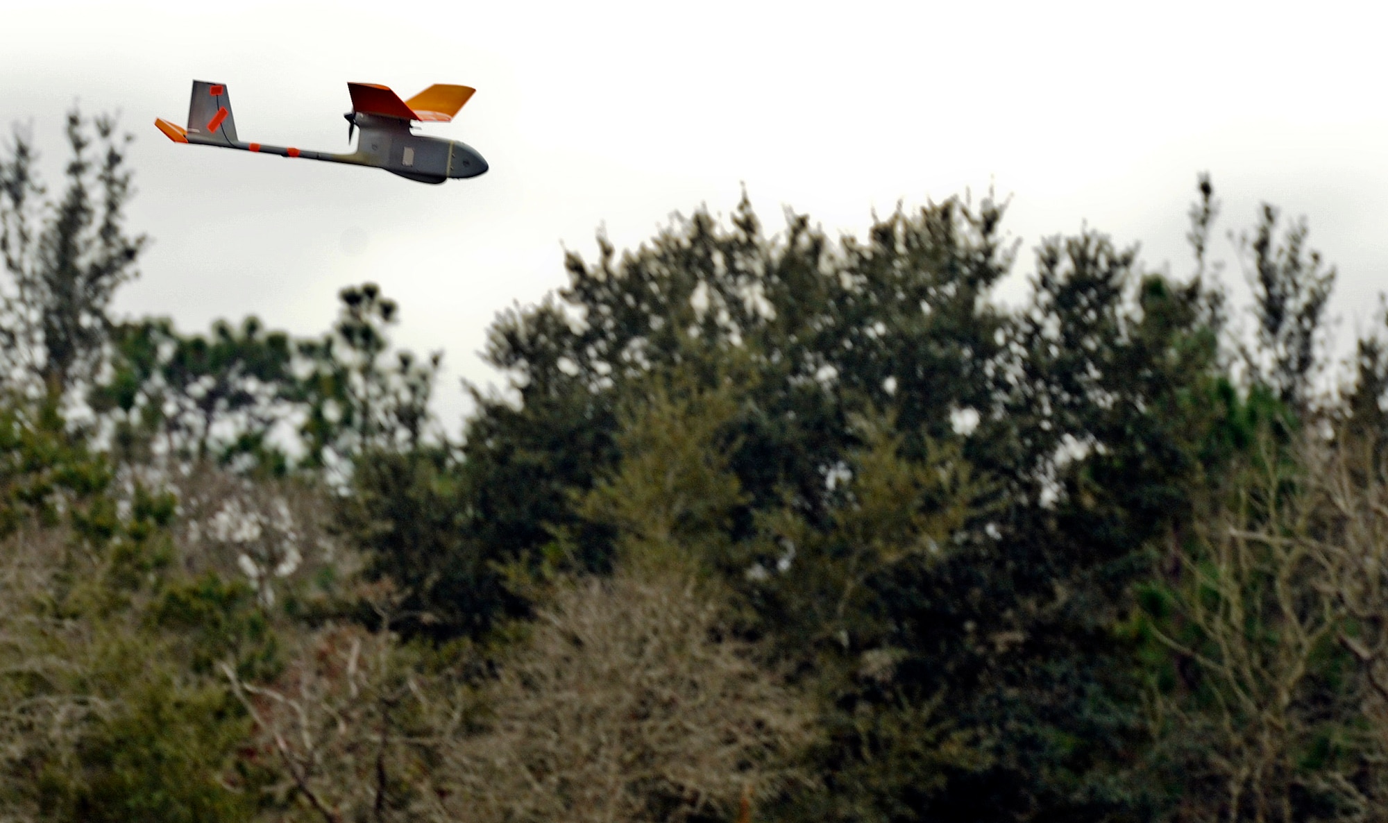 A RQ-11B Raven flies during training at Choctaw Field, Fla., March 4, 2014. This small unmanned aerial system does not require a runway for takeoff. (U.S. Air Force photo/Senior Airman Michelle Patten)
