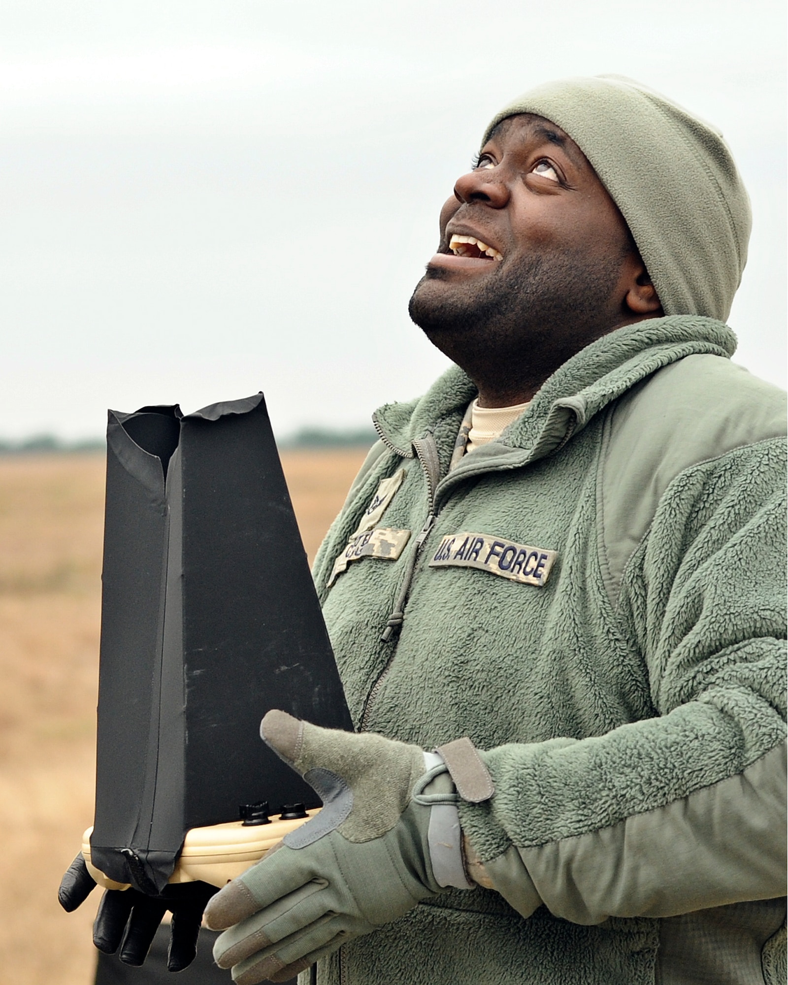 Staff Sgt. Jonathan Carter, 1st Special Operations Security Forces Squadron desk sergeant, watches a RQ-11B Raven fly at Choctaw Field, Fla., March 4, 2014. The small unmanned aerial system can take photographs and live video. (U.S. Air Force photo/Senior Airman Michelle Patten)