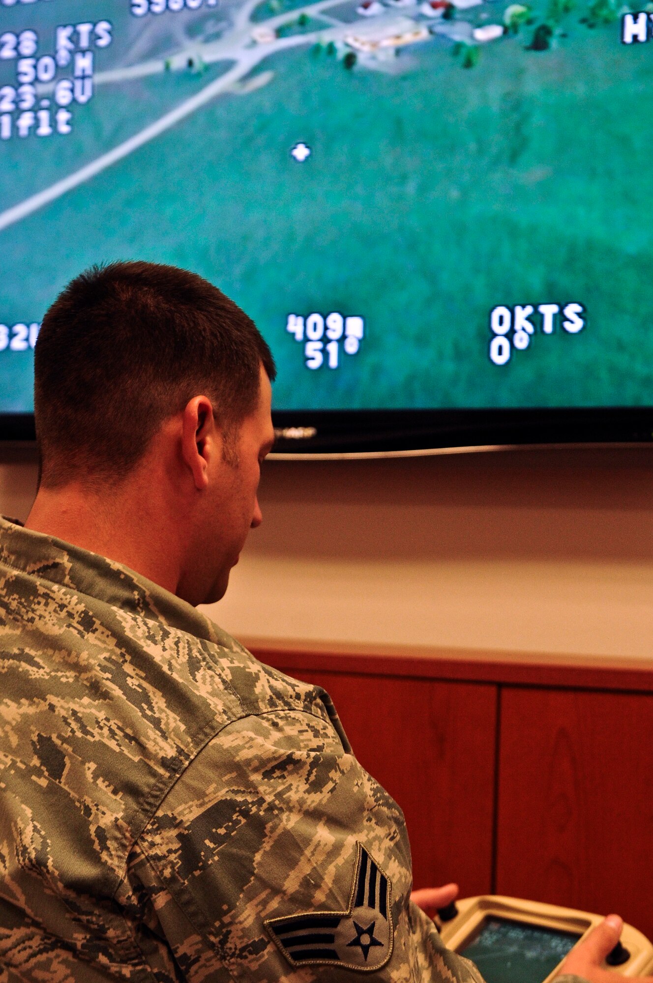 Senior Airman Andrew Goffeney, 1st Special Operations Security Forces Squadron combat arms journeyman, practices using a small unmanned aerial system simulator in a unit training room at Hurlburt Field, Fla., March 4, 2014. Goffeney completed the simulator training to practice navigating the RQ-11B Raven. (U.S. Air Force photo/Senior Airman Michelle Patten)

