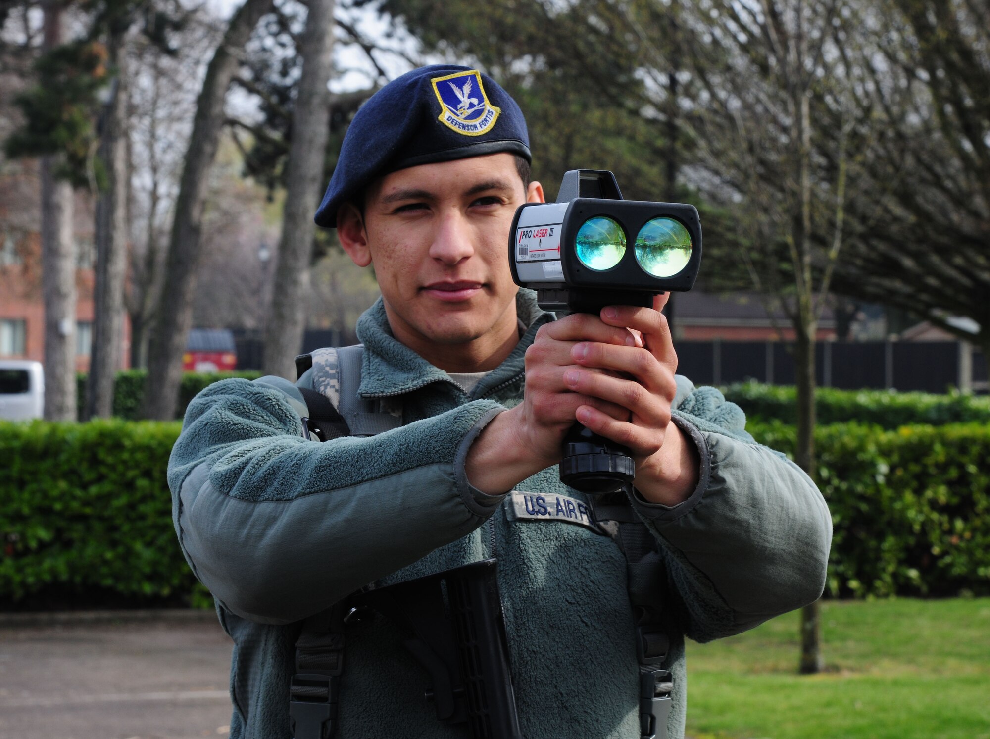 U.S. Air Force Senior Airman Angel Trejo, 100th Security Forces Squadron response force leader, uses the Lidar – Pro Laser III to check the speed of vehicles March 14, 2014, on RAF Mildenhall, England. One responsibility of the 100th SFS is to ensure drivers adhere to the posted speed limits on base. The radar gun gives the 100th SFS Airmen an accurate reading of a vehicle’s speed. (U.S. Air Force photo by Staff Sgt. Rachel Waller/Released)
