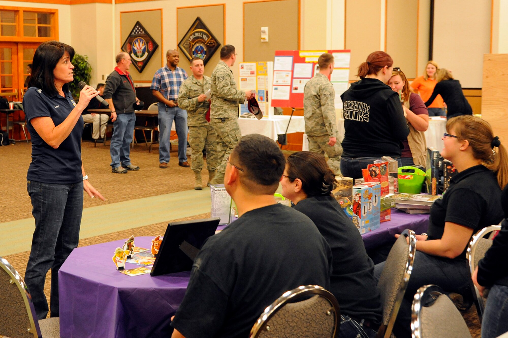 Lori Muzzana, 341st Missile Wing community support coordinator, welcomes local community members to Malmstrom’s 2014 Community Fair on March 7 at the Grizzly Bend. During the fair, more than 60 businesses, organizations and clubs set up display tables and more than 750 Airmen were in attendance, making this one of the biggest community outreach programs Malmstrom has hosted. (U.S. Air Force photo/Airman 1st Class Collin Schmidt)  
