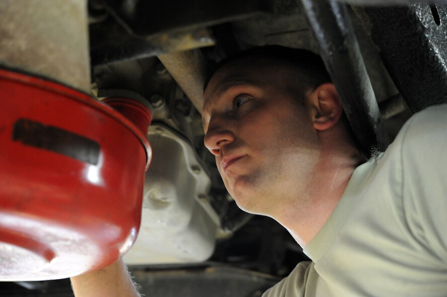 Tech Sgt. Kevin Pennington, 341st Logistics Readiness Squadron vehicle mechanic, changes his oil at the base auto hobby shop March 7. The auto shop offers a variety of tools for repairing a car. (U.S. Air Force photo/Airman 1st Class Joshua Smoot)