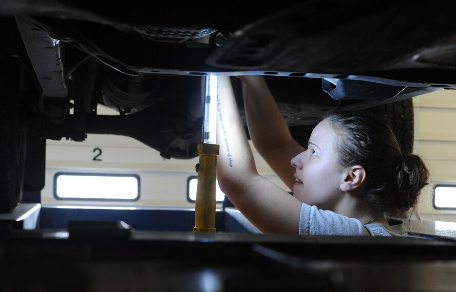 Airman Cassidy Green, 341st Medical Operations Squadron medical technician, loosens bolts from under her truck at the base auto hobby shop March 7. The auto shop is open Tuesday to Friday from 1 to 9 p.m., Saturday 9 a.m. to 5 p.m. and Sunday 9 a.m. to 2 p.m. (U.S. Air Force photo/Airman 1st Class Joshua Smoot)