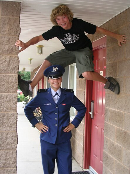 David Wise clings to a wall above his sister Christy Wise while visiting her in 2005 at the Air Force Academy in Colorado Springs, Colo. David Wise, who recently won a gold medal at the Sochi, Russia, Olympics, grew up skiing with Christy and her twin sister Jessica. (Courtesy photo)

