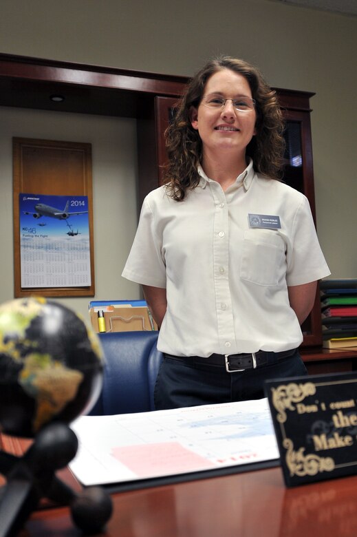 ALTUS AIR FORCE BASE, Okla. -- Brandi Roblez, 97th Maintenance Directorate workforce analyst and personnel liaison, stands in her office March 12, 2014. Roblez has worked for the 97th for 13 years and was the first female student to graduate from the local Grow-Your-Own program for maintenance professionals here in Altus. (U.S. Air Force photo by Senior Airman Dillon Davis/Released)