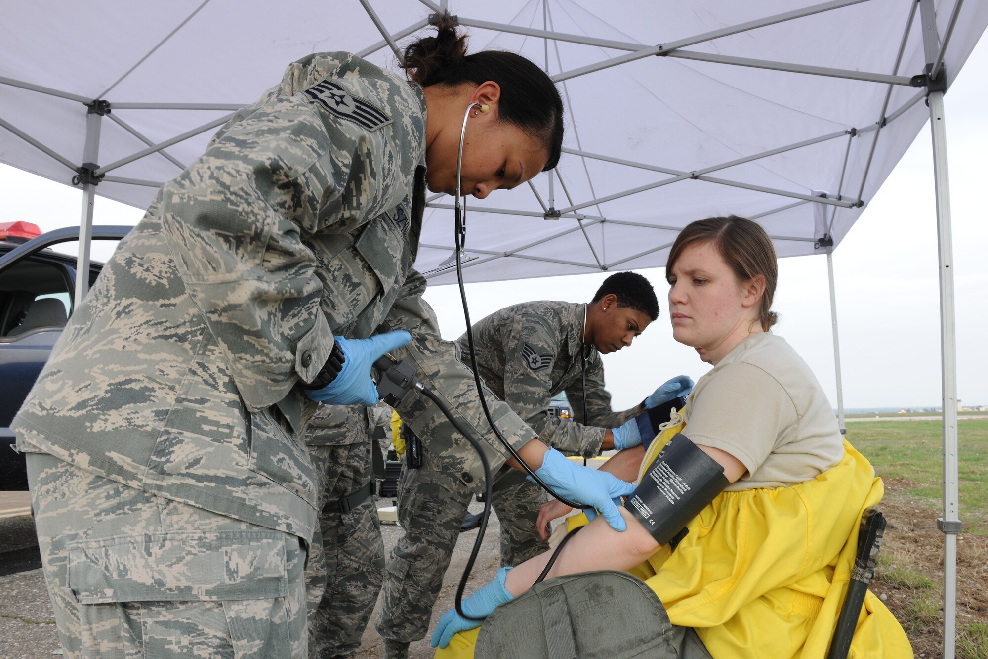Staff Sgt. Maria Szymanski, 39th Medical Operations Squadron aerospace medical technician, takes vitals on an Airman participating in an emergency response training exercise March 12, 2014, Incirlik Air Base, Turkey.  First responders including security forces, fire, medical and explosive ordnance disposal Airmen often practice scenarios for emergency situations to keep their skills sharp and procedures up to standard.  (U.S. Air Force photo by Senior Airman Nicole Sikorski/Released)