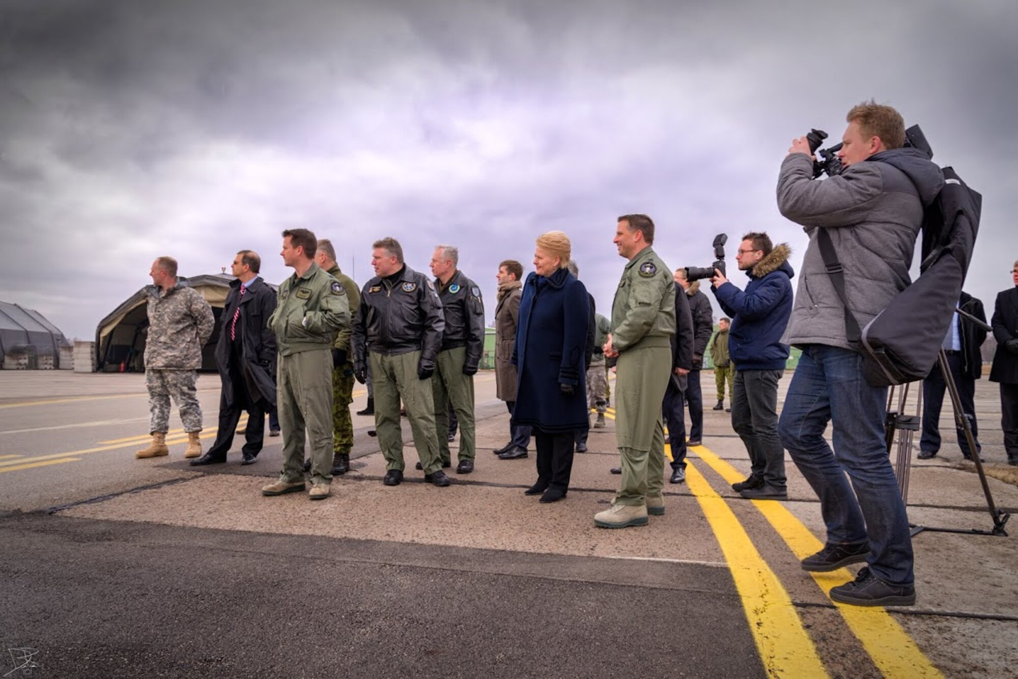 Dalia Grybauskaitė, president of Lithuania, members of the 48th Air Expeditionary Group and members of the media look at F-15C Eagles at Šiauliai Air Base, Lithuania March 5, 2014. President Dalia Grybauskaitė got a closer look at the F-15C Eagles’ air superiority capabilities during her visit. The U.S. Air Force has deployed 10 jets and more than 200 personnel in support of NATO’s Baltic Air Policing mission which safeguards the air sovereignty of allies in the Baltic region. (Courtesy photo by Tech. Sgt. Nick Hodge)