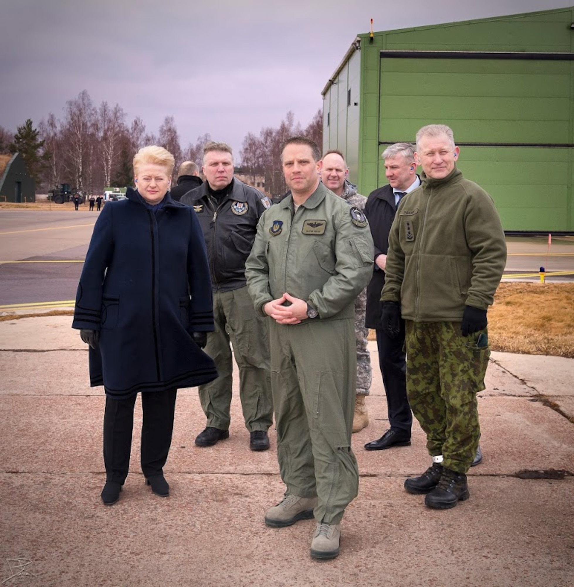 Lt. Col. Mark Sadler, 493rd Expeditionary Fighter Squadron commander, and  Dalia Grybauskaitė, president of Lithuania, pose for a photo at Šiauliai Air Base, Lithuania March 5, 2014. President Dalia Grybauskaitė got a closer look at the F-15C Eagles’ air superiority capabilities during her visit. The U.S. Air Force has deployed 10 jets and more than 200 personnel in support of NATO’s Baltic Air Policing mission which safeguards the air sovereignty of allies in the Baltic region. (Courtesy photo by Tech. Sgt. Nick Hodge)
