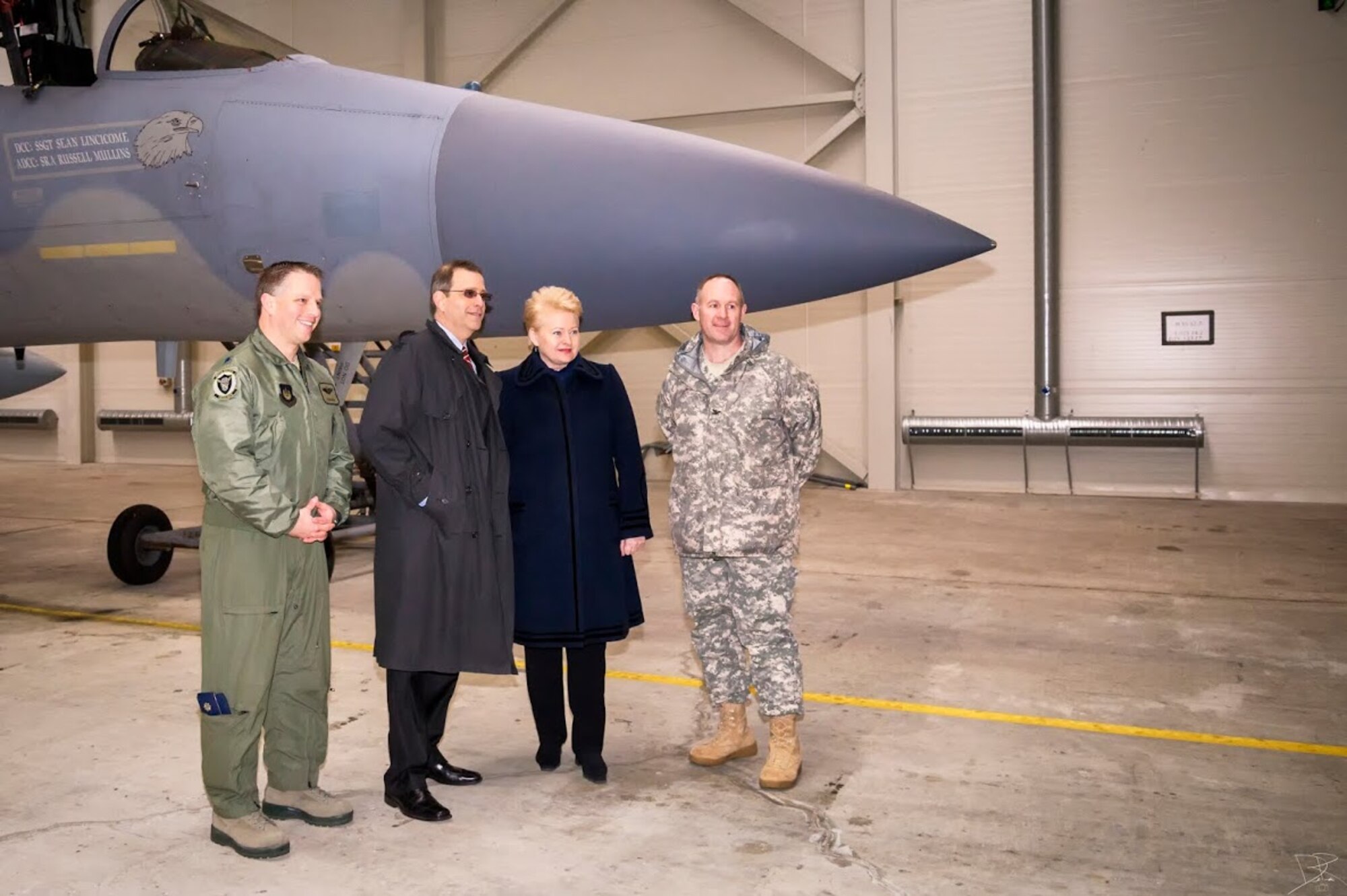 Lt. Col. Mark Sadler, 493rd Expeditionary Fighter Squadron commander, Dalia Grybauskaitė, president of Lithuania and U.S. Army Col. Jeffrey Lee Jennette, U.S. Defence attaché to Lithuania, pose for a photo in front of an F-15C Eagle at Šiauliai Air Base, Lithuania March 5, 2014. President Dalia Grybauskaitė got a closer look at the F-15C Eagles’ air superiority capabilities during her visit. The U.S. Air Force has deployed 10 jets and more than 200 personnel in support of NATO’s Baltic Air Policing mission which safeguards the air sovereignty of allies in the Baltic region. (Courtesy photo by Tech. Sgt. Nick Hodge)
