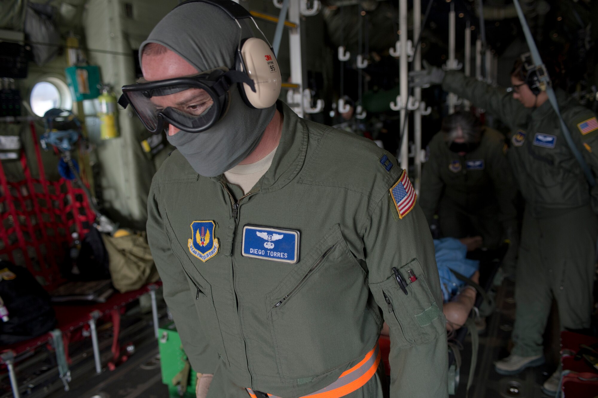 Capt. Diego Torres, 86th Aeromedical Evacuation Squadron flight nurse instructor, simulates an evacuation inside a C-130J Super Hercules during a training opportunity that measured the crew’s capabilities to handle in-flight scenarios March 6, 2014, Ramstein Air Base, Germany. Removing and relocating injured personnel to receive greater medical attention as quickly and effectively as possible is pertinent in saving lives. (U.S. Air Force photo/Airman 1st Class Jordan Castelan)
