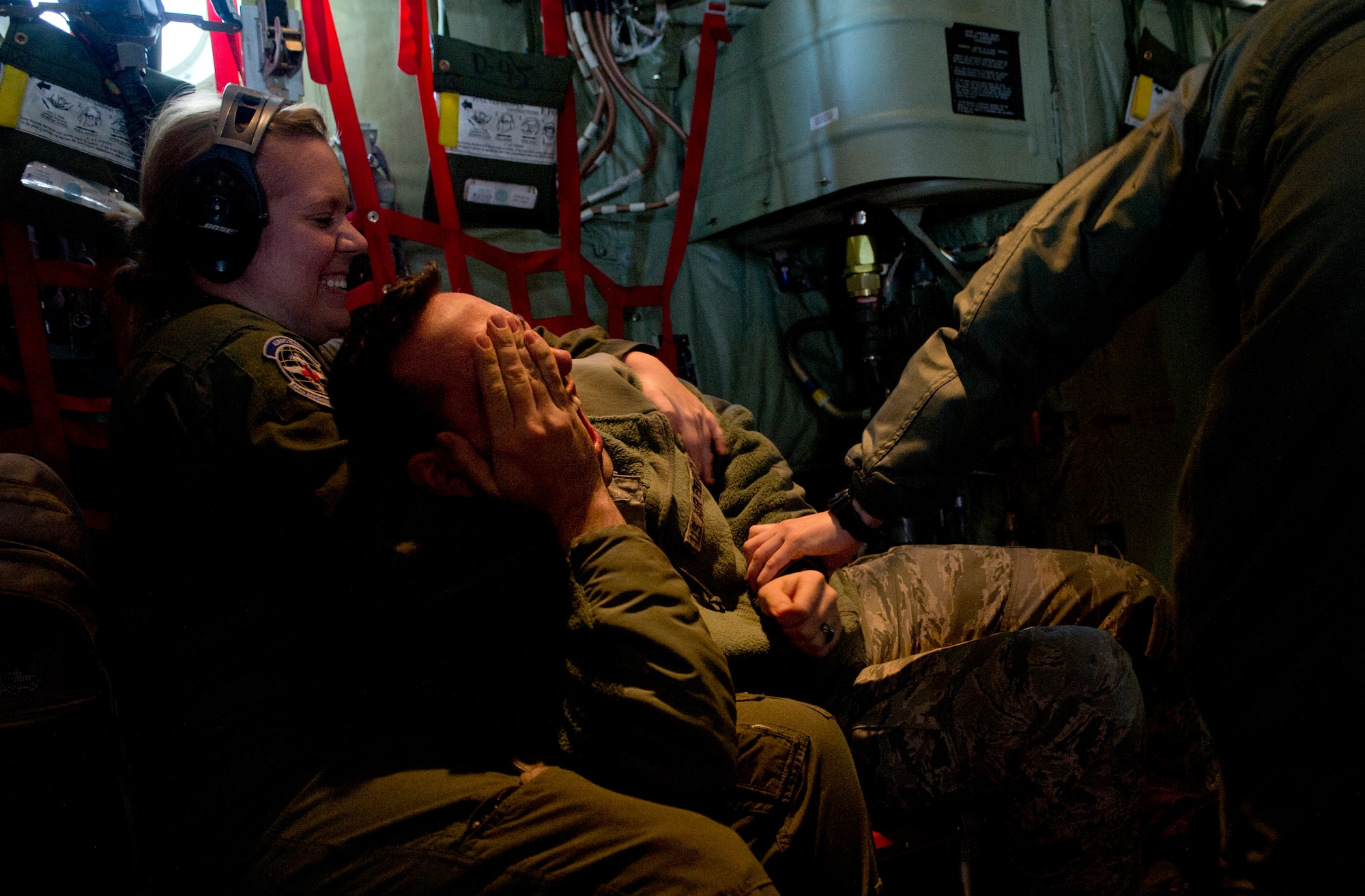 Staff Sgt. Lindsay Rhodes, 86th Aeromedical Evacuation Squadron aeromedical evacuation technician, restrains Staff Sgt. David Meade, 86th Airlift Wing public affairs broadcaster, inside a C-130J Super Hercules during a training opportunity that measured the crew’s capabilities to handle in-flight scenarios March 6, 2014, Ramstein Air Base, Germany. Subduing, restraining and removing unruly and potentially dangerous passengers are a threat that 86th AES technicians have to be prepared for. (U.S. Air Force photo/Airman 1st Class Jordan Castelan)