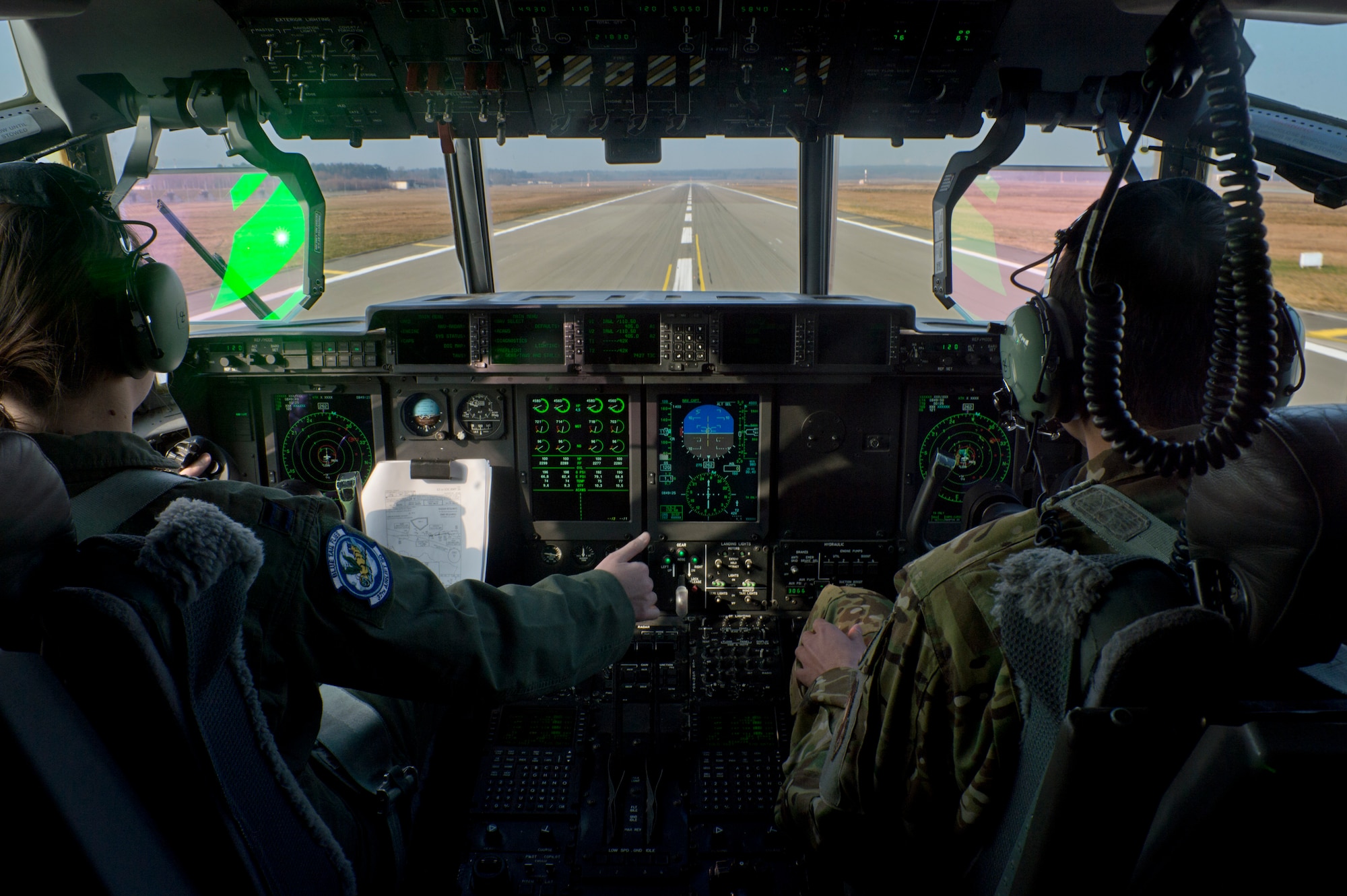 Capt. April Brown, 37th Airlift Squadron pilot instructor, and 1st Lt. Christopher Ansel, 40th AS co-pilot, land a C-130J Super Hercules during an 86th Aeromedical Evacuation Squadron training opportunity March 6, 2014, Ramstein Air Base, Germany. Pilots with the 37th AS are responsible for flying Ramstein’s workhorse airframe and ensuring prompt and successful completion of every mission. (U.S. Air Force photo/Airman 1st Class Jordan Castelan)
