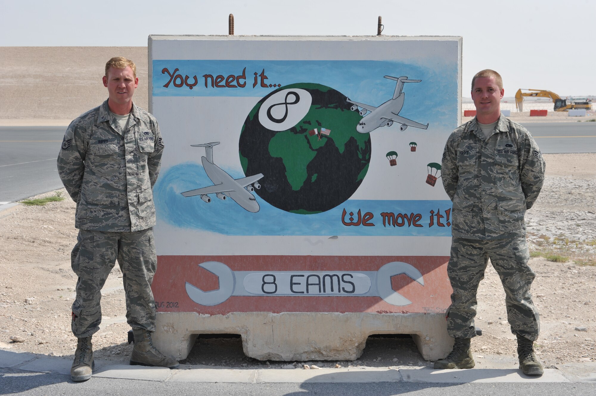 Staff Sgt. David Rippy and Senior Airman Mark Rippy, both reservists deployed from the 315th Aircraft Maintenance Squadron, Charleston Air Force Base, S.C., pose for a picture at Al Udeid Air Base, Qatar, Mar.11, 2014. Mark arrived in March and is the direct replacement for David at the 8th Expeditionary Aircraft Maintenance Squadron where both are hydraulic systems specialist supporting C-17 Globemaster IIIs that fly missions in support of Operation Enduring Freedom.  (U.S. Air Force photo by Master Sgt. David Miller)