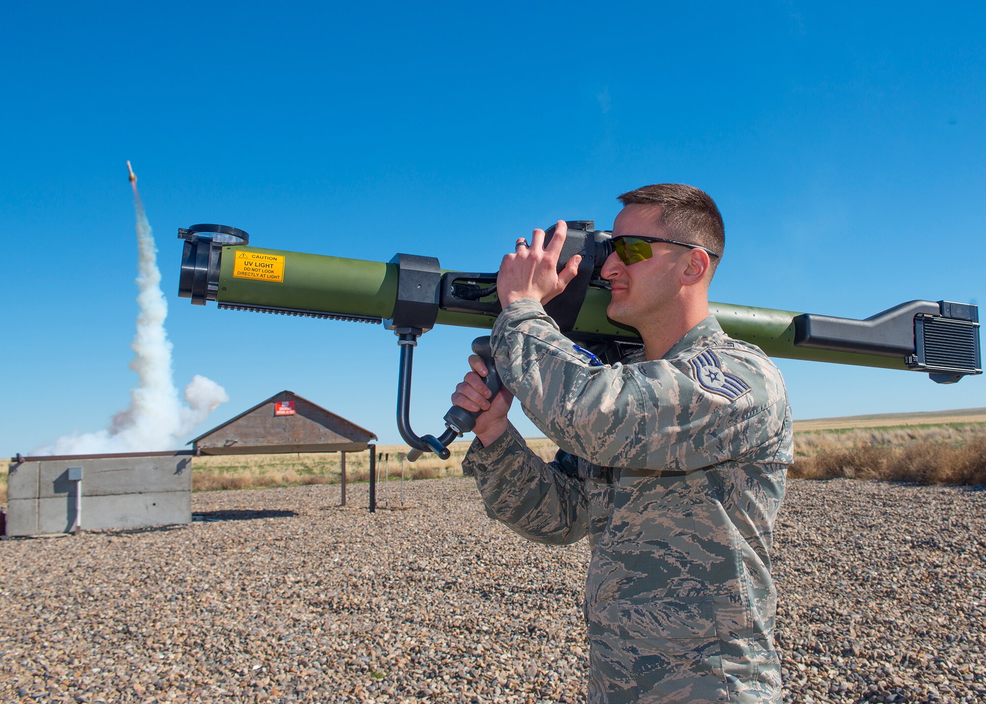 Staff Sgt. Michael Sheehan, 266th Range Squadron ground radar operator technician fires a man-portable aircraft survivability trainer at Saylor Creek Range at Mountain Home Air Force Base, Idaho, March 13, 2014. The MAST is used to train aircrews to react to surface to air missiles threats during live training exercises.  Members from the 226th RANS play an invaluable role in Gunfighter Flag 14-2 by providing support to U.S. and coalition forces for future deployments. (U.S. Air Force photo by Tech. Sgt. JT May III/RELEASED)