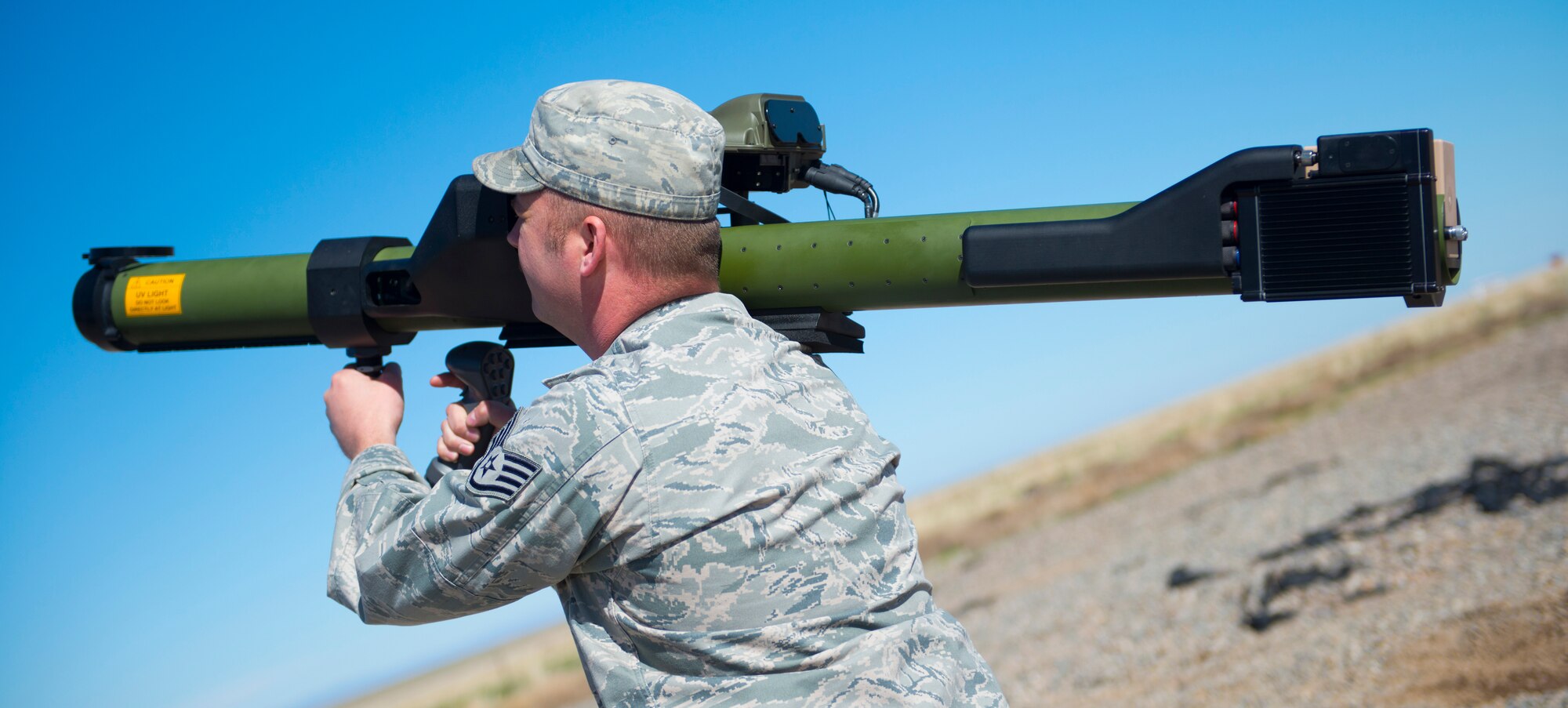 Staff Sgt. Justin Demontte, 266th Range Squadron ground radar operator technician, fires a man-portable aircraft survivability trainer for exercise purposes at Saylor Creek Range at Mountain Home Air Force Base, Idaho, March 13, 2014. Members from the 266th RANS squadron members work with U.S. Air Force, Marine Corps and British Army during Gunfighter Flag 14-2. The exercise fosters joint force training for future  deployments. (U.S. Air Force photo by Airman 1st Class Malissa Lott/RELEASED)