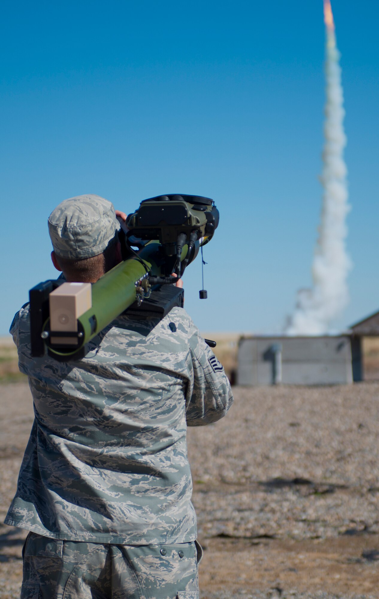 Staff Sgt. Justin Demontte, 266th Range Squadron ground radar operator technician, fires a man-portable aircraft survivability trainer for exercise purposes at Saylor Creek, Mountain Home Air Force Base, Idaho, March 13, 2014. Members from the 266th RANS squadron shoot Smokey SAMs as part of Gunfighter Flag 14-2. (U.S. Air Force photo by Airman 1st Class Malissa Lott/RELEASED)