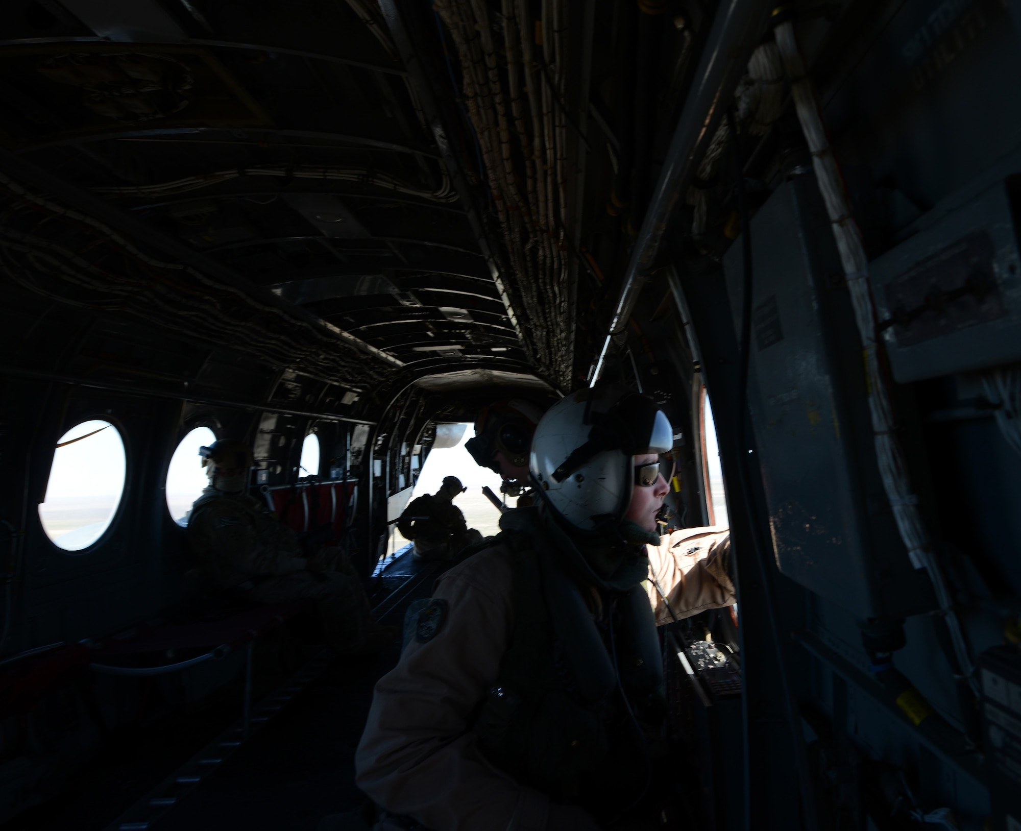 A Marine inside a CH-46 Sea Knight helicopter as it takes off March 13, 2014, from Mountain Home Air Force Base, Idaho. Marines from the 3rd Marine Aircraft Wing at Marine Corps Air Station Miramar, Calif., are currently at MHAFB participating in Gunfighter Flag.  The exercise is designed to prepare multiple joint and coalition terminal attack controller teams for upcoming deployments as well as provide proficiency training for aircrews. (U.S. Air Force photo by Senior Airman Benjamin Sutton/Released)