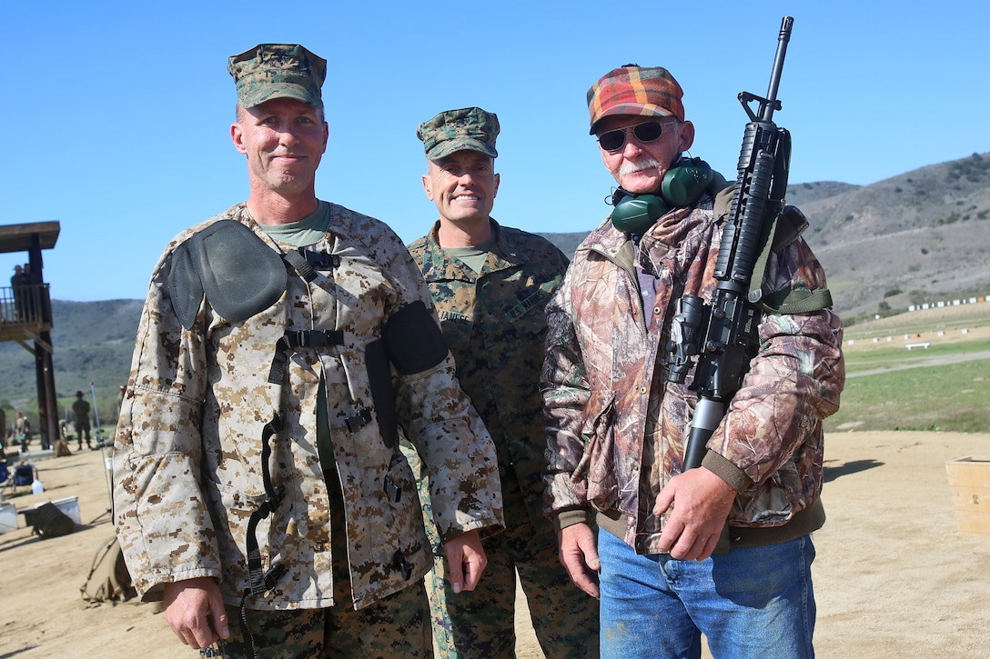 Marine Corps Sgt. Erik A. Anderson, left, his father, Elmo Anderson ...